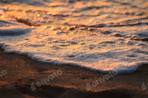 Preview: Wave With Foam In A Beach At The Sunset