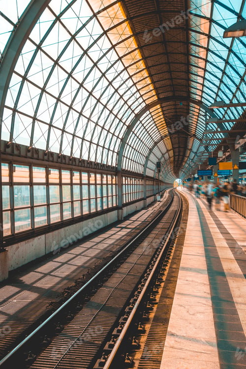 Preview: Modern And Curved Train Station With Blurred Traveler