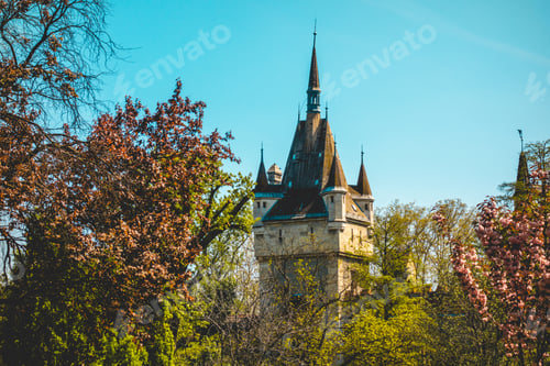 Preview: Tower Of An Old Castle With Some Colorful Trees In The Foreground