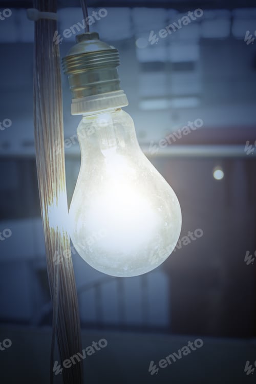 Preview: Glowing Lightbulb on Dark Background