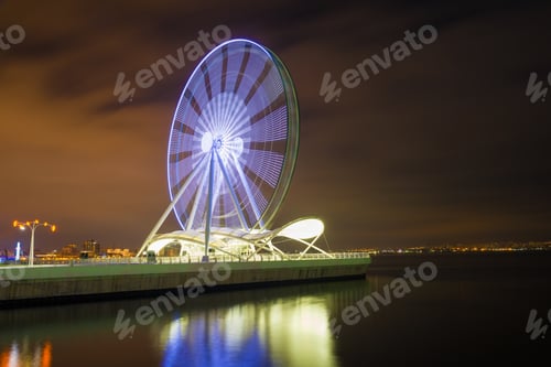 Preview: A Working Ferris Wheel On The Background Of Baku Bay On A Winter Night. Baku, Azerbaijan