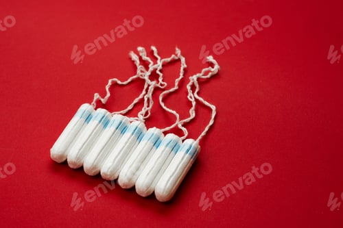 Preview: Tampons Isolated On Red Background. Concept Women Sanitary Protect
