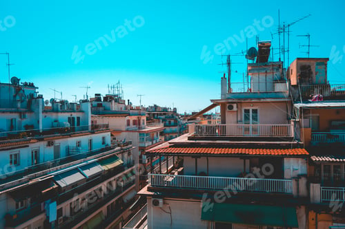 Preview: A Crowded European Slum Cityscape With Tall Apartment Buildings On A Clear Sunny Day.