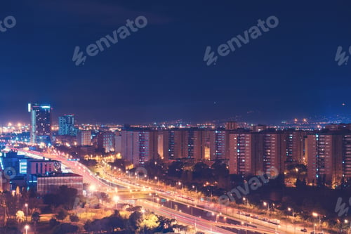 Preview: Birds Eye View Of Bright Streaks Of Light From Traffic At Night In City With Various High Rise