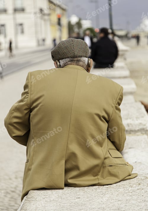 Preview: Elderly Man With Audio Phones Sitting In Park, Retired People