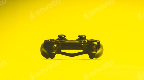 Preview: Black Game Controller Or Console On A Bright Vibrant Yellow Background With Copy Space In A Side