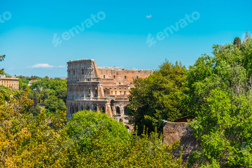 Preview: Walls Of Ancient Colosseum Amphitheater Remains Viewed Among Green Trees Foliage - Rome, Italy