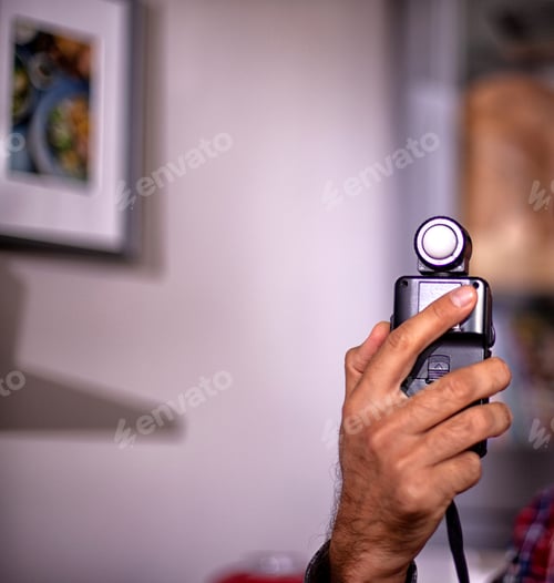 Preview: Hand Held Light Meter Isolated In Studio Lights.