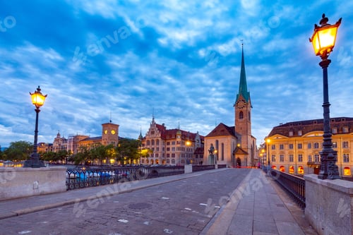 Preview: Munsterbrucke Bridge And The Bell Tower Of The Fraumunster Church At Sunset.