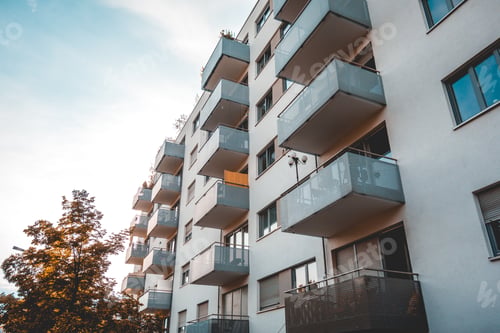 Preview: White Colored Building With Steel Balcony