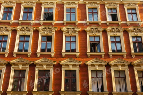Preview: Red Facaded Brick Apartment Building With Stucco Windows