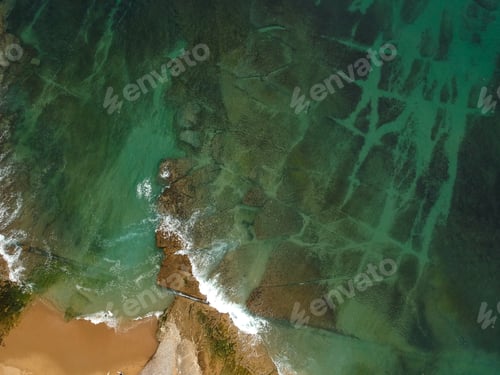 Preview: Aerial View Of The Beach On A Clear Day . Drone Shot On A Beach With Clear Sea Water.