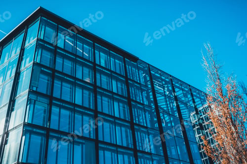 Preview: Low Angle View On Energy Efficient Office Building Exterior With Various Window Shades And Skylights
