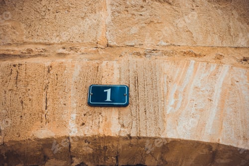 Preview: Number One Door Sign On Marble Facade