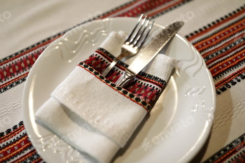 Preview: Fork With Knife In Embroidered Napkin On Plate