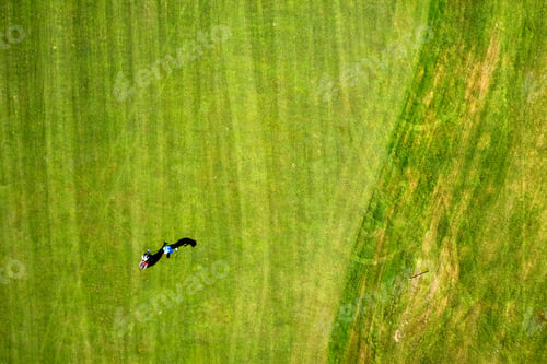 Preview: Aerial View Of A Golf Competition On Green Grass