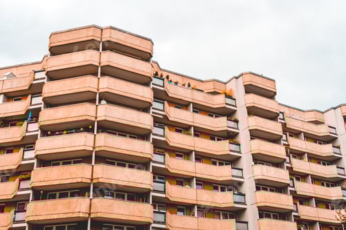 Preview: Typical Orange Plattenbau Complex With Long Balcony