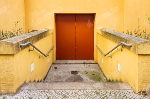 Preview: Red Door On Yellow Building
