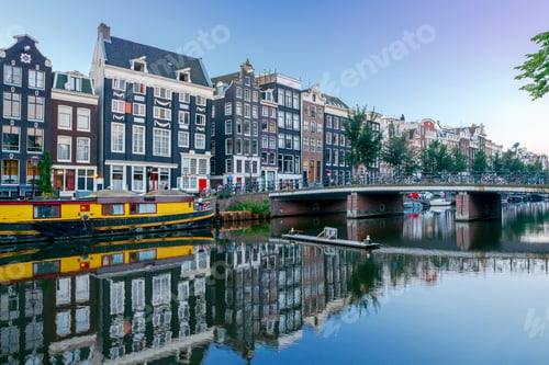 Preview: City Canal With Glowing Lights Early In The Morning. Amsterdam. Netherlands.