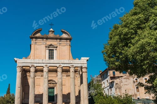 Preview: Temple Of Antoninus And Faustina In Rome, Italy, Viewed From The Front Facade, With Green Tree On