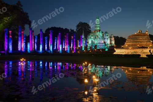 Preview: Ruins Of The Buddhist Temple Wat Mahathat In Festive Illuminations In The Late Evening. Sukhothai