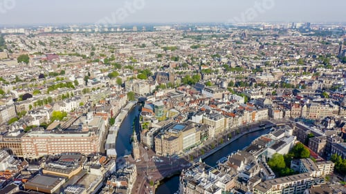 Preview: Amsterdam, Netherlands. Flying Over The City Rooftops. The Historical Part Of The City With Urban