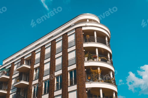 Preview: Beautiful Modern Building With Curved Balcony And Powerful Sky