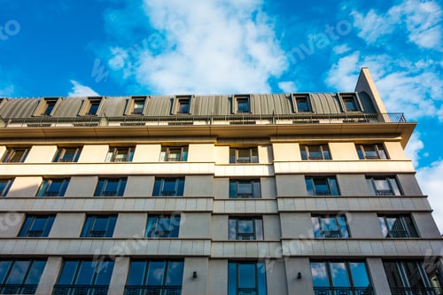 Preview: White Facade Of Building With Cloud Reflections
