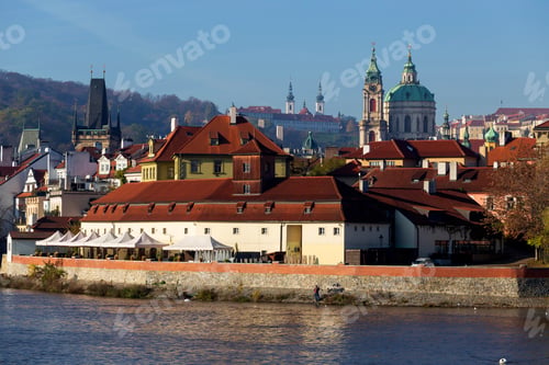 Preview: Autumn Colorful Prague Lesser Town With St. Nicholas' Cathedral Above River Vltava In The Sunny