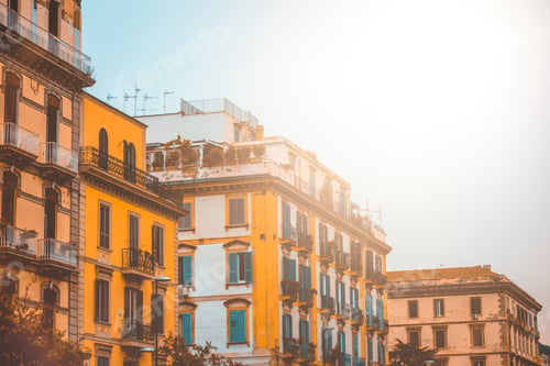 Preview: Orange Apartment Houses In Warm Sunlight