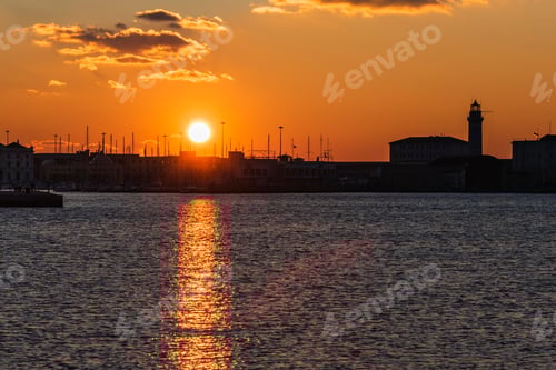 Preview: Sunset From The Audace Pier Of Trieste. Colors Of Fire On The Water. Italy