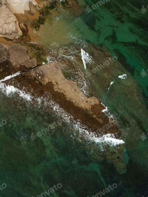 Preview: Aerial View Of The Beach On A Clear Day . Drone Shot On A Beach With Clear Sea Water.