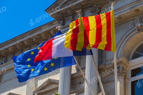 Preview: Multi-Colored Waving National Flags On The Facade Of The City Hall. Avignon. France. Provence