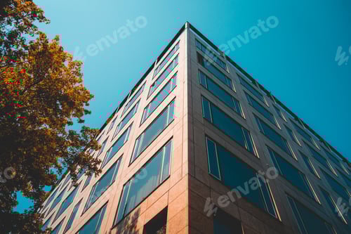 Preview: Low Angle View Of Corner Office Building With Modern Facade