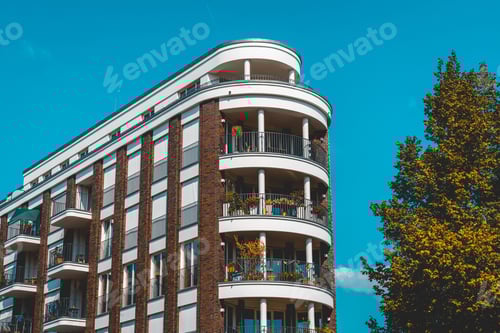 Preview: Modern And Curved Corner Building For Real Estate With Tree On The Side