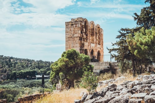 Preview: Tall Stone Arches For Windows In Ancient Greek Ruins With Rocks And Foliage In Foreground