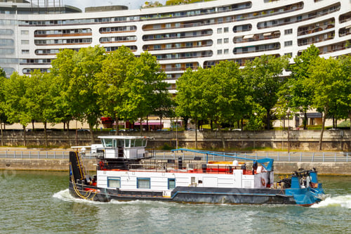 Preview: Paris. Pusher Ship Floating On The River Seine Along The City Blocks.