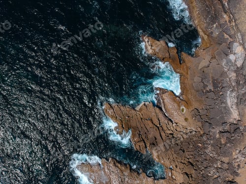 Preview: Aerial Top View Of Sea Waves Hitting Rocks On The Beach With Turquoise Sea Water. Amazing Rock