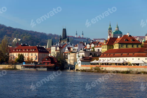 Preview: Autumn Colorful Prague Lesser Town With St. Nicholas' Cathedral Above River Vltava In The Sunny