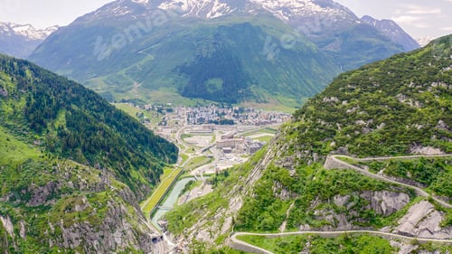 Preview: Switzerland. View From Behind A Mountainside On Andermatt. Picturesque Winding Mountain Road With