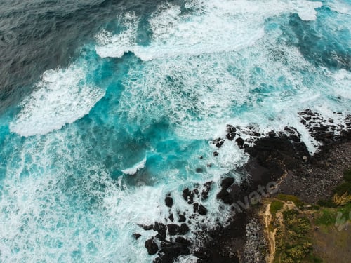 Preview: Aerial Top View Of Sea Waves Hitting A Beach With Black Volcanic Sand With Turquoise Sea Water