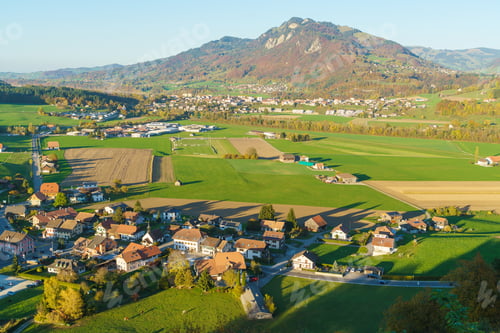 Preview: Aerial View Of A Beautiful Landscape With Traditional Houses, Green Meadows, Hills And Cows Near