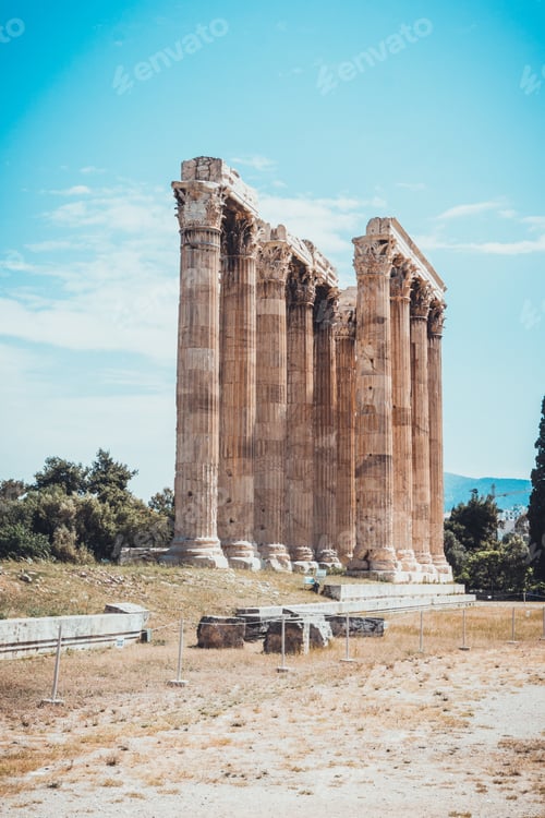 Preview: Vertical Columns Of Abandoned Temple Of Zeus With Dirt Path In Foreground Under Blue Sky