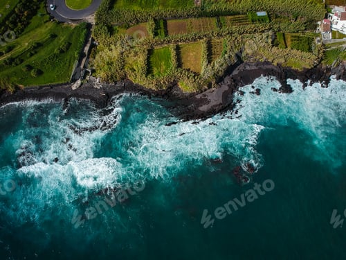 Preview: Aerial Top View Of Sea Waves Hitting A Beach With Black Volcanic Sand With Turquoise Sea Water