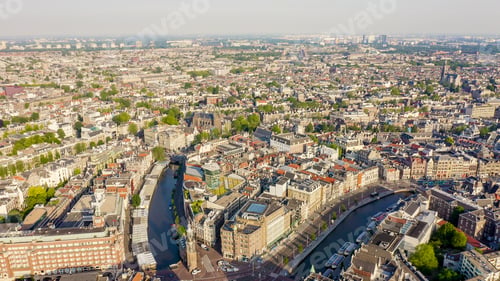 Preview: Amsterdam, Netherlands. Flying Over The City Rooftops. The Historical Part Of The City With Urban