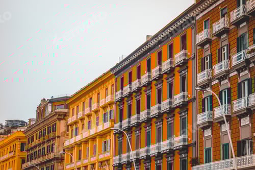 Preview: Orange And Yellow Houses In A Row At Italy