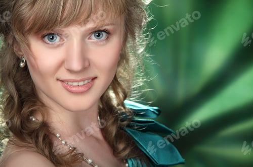 Preview: Portrait Of Beautiful Girl With Curly Hair On A Green Background