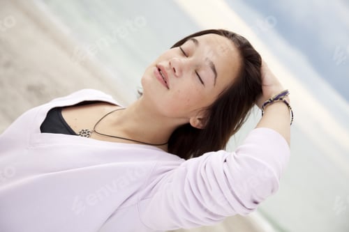 Preview: Portrait Of Beautiful Brunet Girl On The Beach.