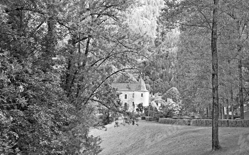Preview: Deserted Park In France In Black And White. Castle In Medieval French City Of Florac
