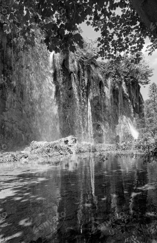Preview: Grayscale. Waterfall Reflection In Small Clear Transparent Lake (Plitvice Lakes National Park